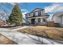 Inviting two-story home boasts professional landscaping and striking modern black and white exterior at 4176 Zenobia St, Denver, CO 80212