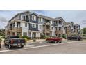 Attractive multi-Gathering condo complex showcasing stone accents, covered balconies, and convenient parking at 5255 Memphis St # 224, Denver, CO 80239