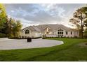 Charming single-story home with circular driveway and manicured lawn at 4935 E Preserve Ln, Greenwood Village, CO 80121
