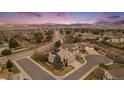 Beautiful aerial view of a house in a peaceful neighborhood, showcasing its prime location and picturesque surroundings at 15907 W 72Nd Dr, Arvada, CO 80007