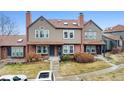Charming townhome with brick and siding exterior, featuring a well-manicured front yard and inviting entryway at 17467 E Rice Cir # C, Aurora, CO 80015