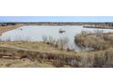 Breathtaking lake view showcasing a serene body of water and the surrounding natural landscape at 17467 E Rice Cir # C, Aurora, CO 80015