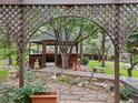 Relaxing backyard gazebo sitting among the mature trees and professionally landscaped yard at 1025 S Butler Way, Lakewood, CO 80226
