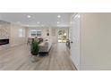 Open living room with fireplace, neutral decor, and sliding door to backyard at 2230 Jamaica, Aurora, CO 80010
