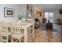 Charming dining area with a table and chairs, adjacent to the living room at 3082 S Wheeling Way # 410, Aurora, CO 80014