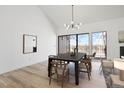 Dining room with a large table, chairs, and sliding doors leading to a deck at 6539 Pinewood Dr # 57, Parker, CO 80134