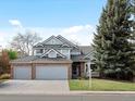 Lovely two-story house with brick accents, a three-car garage, and inviting curb appeal at 1792 W Kettle Ave, Littleton, CO 80120
