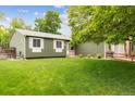 Lovely single-story home with a lush green lawn and beautiful landscaping at 5007 S Richfield Cir, Aurora, CO 80015