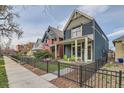 A street view captures the home's facade, nestled among neighboring houses with a charming, inviting curb appeal at 35 Elati St, Denver, CO 80223
