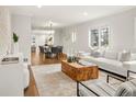 Bright and airy living room with hardwood floors, a modern sofa, and stylish decor at 1401 S Clarkson St, Denver, CO 80210