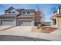 Exterior view of a multi-story home with a two-car garage and well maintained landscaping at 1677 Valley Oak Ct, Castle Rock, CO 80104