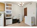 Storage room with a shelving system, a mini fridge, boxes and carpet floors, perfect for organization at 14444 E Colorado Dr # 204, Aurora, CO 80012
