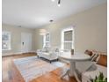 Bright living room featuring hardwood floors and a cozy sitting area at 2537 Chase St, Edgewater, CO 80214