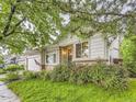 Beautiful home with a well-maintained lawn and inviting curb appeal, enhanced by lush greenery at 19346 E Clear Creek Way, Parker, CO 80134