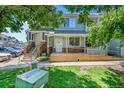 Charming two-story home with inviting front porch and well-manicured lawn at 12943 Lafayette St # F, Thornton, CO 80241