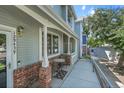 Inviting exterior view with a cozy porch, perfect for relaxing and enjoying the outdoors at 12943 Lafayette St # F, Thornton, CO 80241