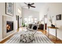 Bright main bedroom boasts vaulted ceilings, a fireplace, and large windows offering plenty of light at 7551 S Garland St, Littleton, CO 80128