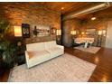 Comfortable living room with a white sofa and unique decor elements at 10111 Inverness Main St # 223, Englewood, CO 80112