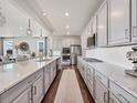Modern kitchen with stainless appliances, granite countertops, and spacious cabinetry at 14565 Vancouver Pl, Parker, CO 80134