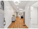 Bright entryway featuring hardwood floors and a skylight provides ample sunlight at 5523 Tejon St, Denver, CO 80221