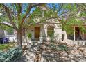 Charming home featuring a manicured front yard and a welcoming entryway at 1529 E 22Nd Ave, Denver, CO 80205