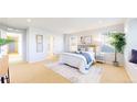 Spacious bedroom with attached bathroom and a comfortable, relaxing setting at 7932 E 49Th Pl, Denver, CO 80238