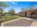 Cozy home featuring stone accents, a well-kept lawn, and inviting walkway at 3251 N Adams St, Denver, CO 80205