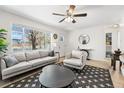 Bright living room featuring a large window, modern decor, and stylish furnishings at 3251 N Adams St, Denver, CO 80205