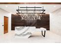 Modern lobby featuring a unique lighting fixture and marble reception desk at 1901 Wazee St # 707, Denver, CO 80202