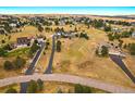 Expansive aerial view shows the home's large lot, proximity to neighbors, and surrounding landscape at 3639 Pine Meadow Ave, Parker, CO 80138