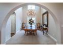 Formal dining room with a chandelier and large windows at 2675 Timberchase Trl, Highlands Ranch, CO 80126