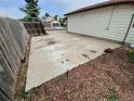 Side yard featuring a large concrete area with wood fencing, perfect for additional parking at 2758 S Salida St, Aurora, CO 80013