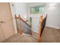 Inviting foyer boasts a staircase, leading to the main floor with natural light from the window above the front door at 33589 Robin Ct, Elizabeth, CO 80107