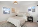 Cozy bedroom with a plush bed and neutral color palette at 4751 S Xenia St, Denver, CO 80237