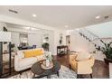 Comfortable living room with stylish furnishings and hardwood floors at 13020 E Linvale Pl, Aurora, CO 80014