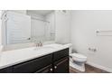 Bathroom featuring a vanity with solid surface countertops and a shower at 485 Interlocken Blvd # 201, Broomfield, CO 80021