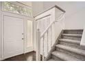 Bright entryway with a staircase, closet, and tile flooring adjacent to the front door at 1800 Centaur Village Dr, Lafayette, CO 80026