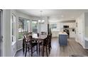 Open floorplan shows the dining room, kitchen, and plenty of natural light at 15432 Greenstone Cir, Parker, CO 80134