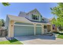 Charming two-story home boasts a three-car garage, well-manicured lawn, and inviting curb appeal in a desirable neighborhood at 15432 Greenstone Cir, Parker, CO 80134