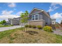 Charming two-story home with a two-car garage and a well-maintained lawn at 113 Marlowe Dr, Erie, CO 80516