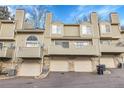 Rear view of townhome showing garages and backyards at 1818 S Quebec Way # 11-8, Denver, CO 80231