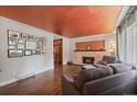 Spacious living room with hardwood floors and fireplace at 3131 S Leyden St, Denver, CO 80222