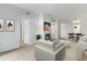 Bright living room with cozy fireplace and neutral décor offers a welcoming atmosphere at 7453 Singing Hills Dr, Boulder, CO 80301