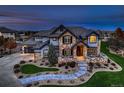 Stunning two-story home features professional landscaping and stone accents at 15102 Prairie Pl, Broomfield, CO 80023