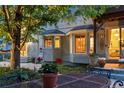 Cozy backyard features a patio, bay windows, and a view of the home's outdoor space at 505 Orchard Dr, Louisville, CO 80027