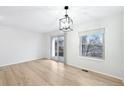 Sunlit living room featuring hardwood floors and large windows with natural light at 1383 W 88Th Ave # 307, Thornton, CO 80260