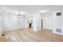 Open-concept living room offering hardwood floors and a view into the kitchen at 1383 W 88Th Ave # 307, Thornton, CO 80260