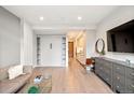 This open-concept space has hardwood floors, a comfortable sofa, and a stylish cabinet at 1901 Wazee St # 305, Denver, CO 80202