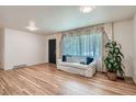 Cozy living room features hardwood floors, natural light, and comfortable seating at 366 Kenton St, Aurora, CO 80010