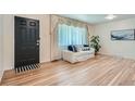 Inviting living room features hardwood floors, natural light, and comfortable seating at 366 Kenton St, Aurora, CO 80010